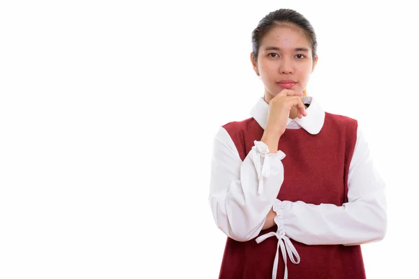 Estudio de tiro de joven mujer asiática pensando — Foto de Stock