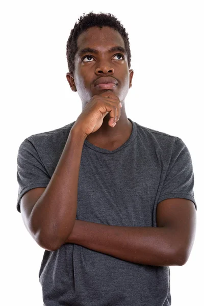 Студийный кадр молодого чернокожего африканского подростка, думающего: — стоковое фото