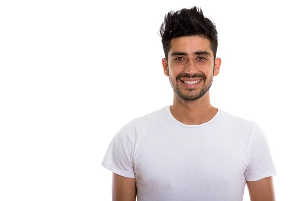Studio shot van jonge gelukkig Perzische man glimlachen — Stockfoto