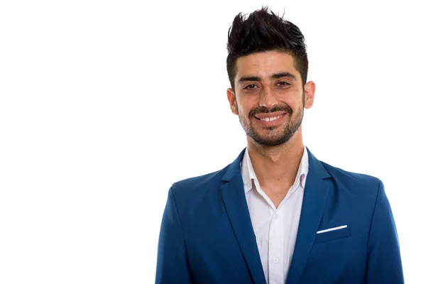 Studioaufnahme eines jungen glücklichen persischen Geschäftsmannes, der lächelt — Stockfoto