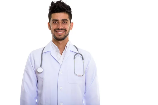 Estudio disparo de joven feliz persa hombre médico sonriendo — Foto de Stock