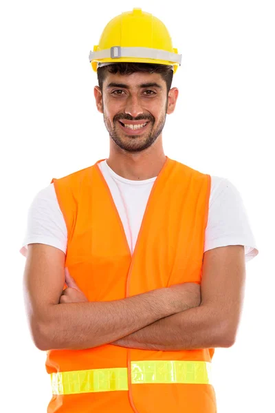 Giovane felice uomo persiano operaio edile sorridente con le braccia cr — Foto Stock