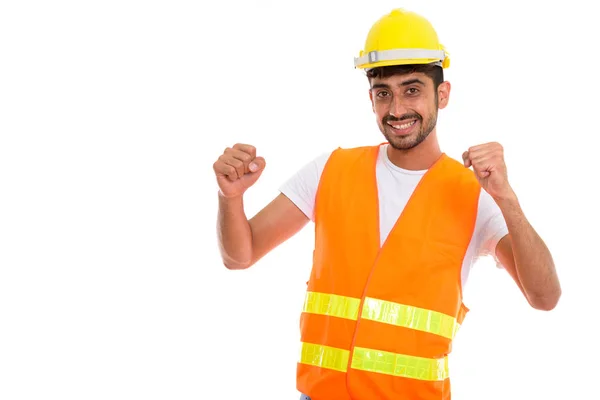 Giovane felice uomo persiano lavoratore edile sorridente mentre cerca — Foto Stock