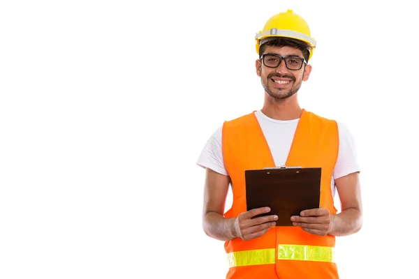 Studio colpo di giovane felice uomo persiano lavoratore edile smili — Foto Stock