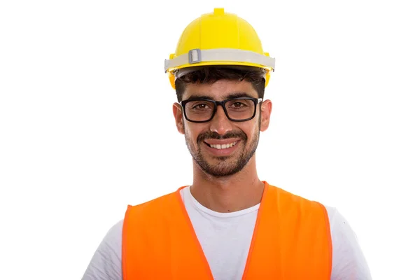 Strzał studio szczęśliwy młodzieńca Perski budowy pracownik smili — Zdjęcie stockowe