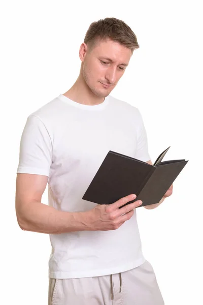 Поганий кавказький чоловік, який читає книжку — стокове фото