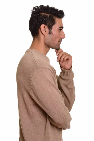 Vista de perfil de joven apuesto hombre persa pensando — Foto de Stock