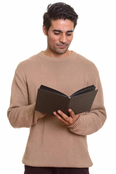 Young handsome Persian man reading book — Stock Photo, Image