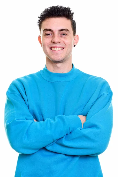 Studio shot of happy young man smiling with arms crossed — Stock Photo, Image