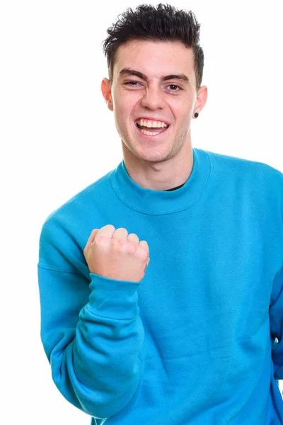 Studio shot of happy young man smiling and looking motivated — Stock Photo, Image