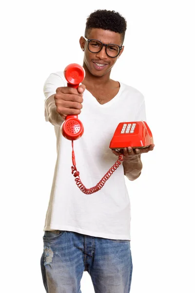 Young happy African man giving telephone — Stock Photo, Image