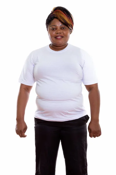 Studio shot of happy fat black African woman smiling and standin — Stock Photo, Image