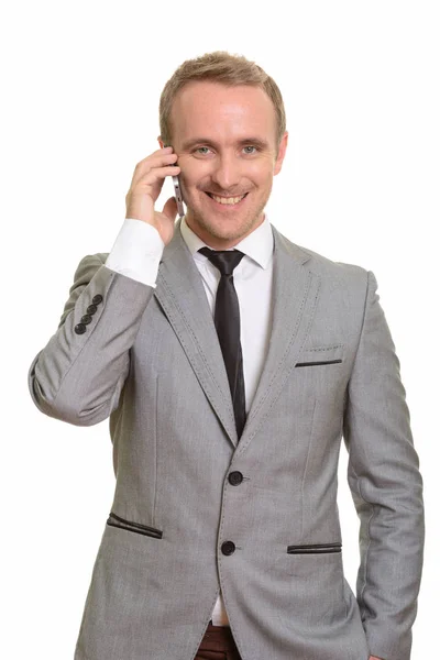 Glad kaukasisk affärsman talar på mobiltelefon — Stockfoto