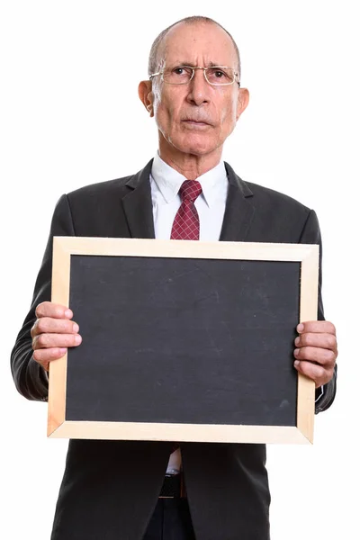 Studioaufnahme eines leitenden Geschäftsmannes mit leerer Tafel — Stockfoto