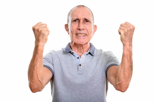 Studio shot of angry senior man with both arms raised — Stock Photo, Image