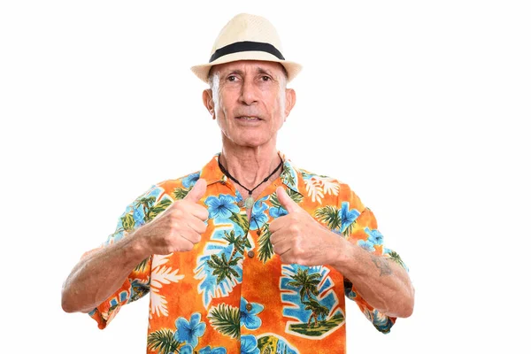 Studio shot of senior man giving thumbs up — Stock Photo, Image