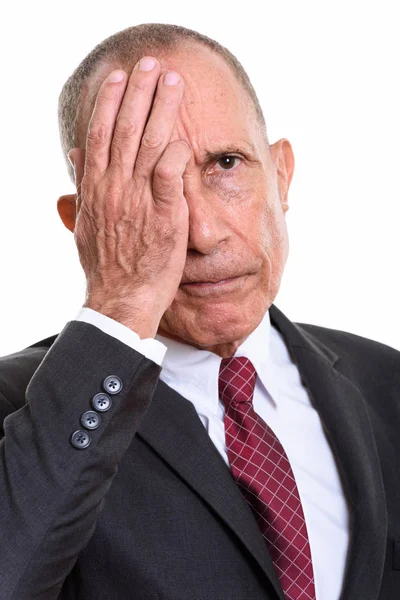 Gezicht van vermoeide senior zakenman kijkt gestresst — Stockfoto