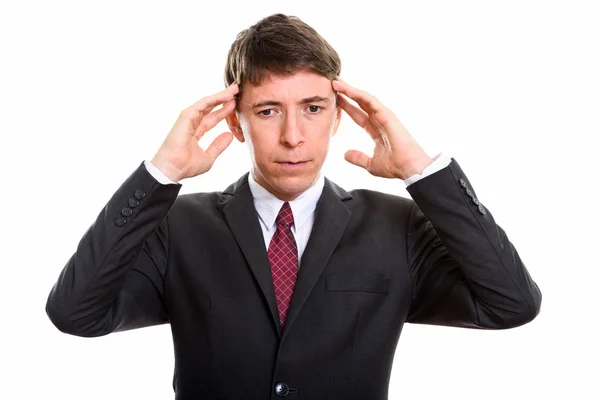 Студийный снимок стресса бизнесмена, страдающего головной болью — стоковое фото