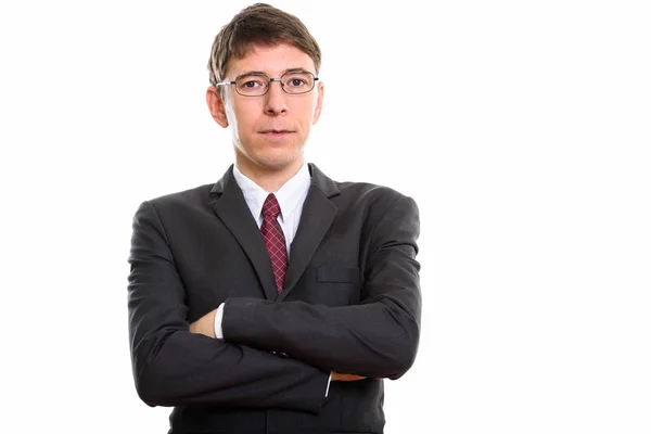 Студийный снимок бизнесмена в очках со скрещенными руками — стоковое фото