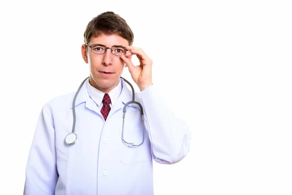 Studio shot of man doctor holding eyeglasses — Stock Photo, Image