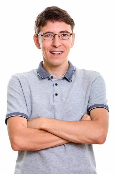 Studio shot of happy man smiling with arms crossed — Stock Photo, Image