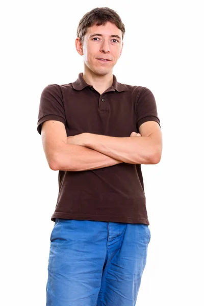 Studio shot of man standing with arms crossed — Stock Photo, Image