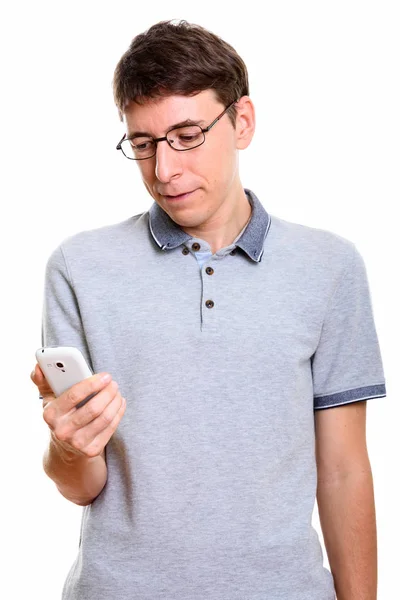 Studio shot of man holding mobile phone — Stock Photo, Image