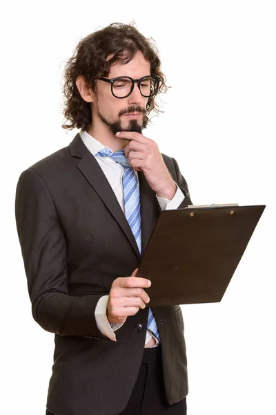 Όμορφος λευκός επιχειρηματίας διαβάζει πρόχειρο ενώ σκέφτεται — Φωτογραφία Αρχείου
