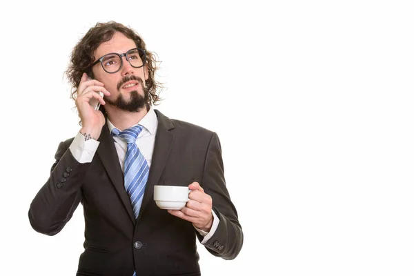 Hermoso hombre de negocios caucásico hablando por teléfono móvil y Holdi —  Fotos de Stock