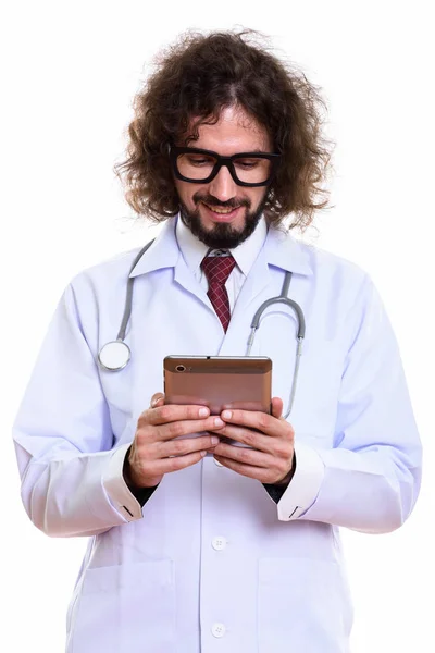 Studio shot of happy man doctor smiling while holding digital ta — Stock Photo, Image