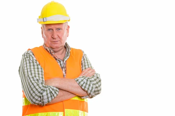Studio záběr stavební dělník s rukama zkříženýma zralý muž — Stock fotografie