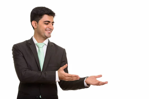 Jovem feliz empresário persa mostrando algo — Fotografia de Stock