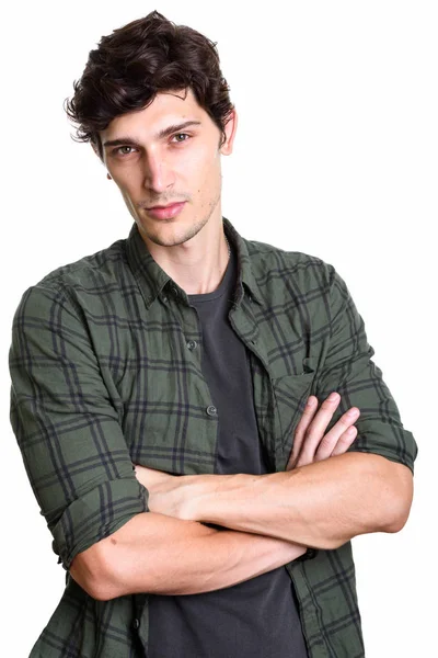 Studio shot of young handsome man with arms crossed — Stock Photo, Image