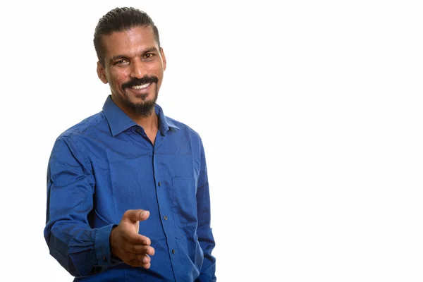 Young happy Indian businessman giving handshake — Stock Photo, Image