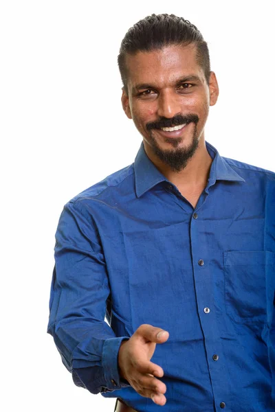 Young happy Indian businessman giving handshake — Stock Photo, Image