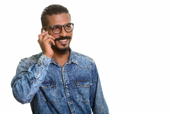 Young happy Indian man talking on mobile phone — Stock Photo, Image