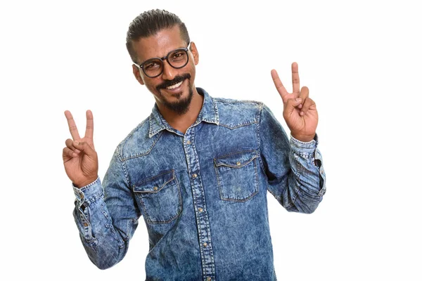 Young happy Indian man giving peace sign — Stock Photo, Image