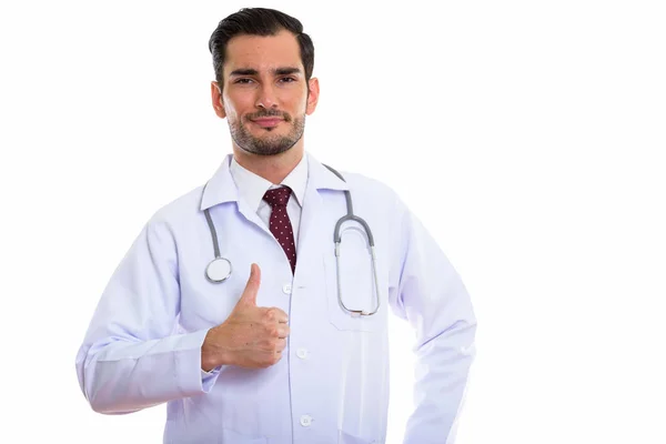 Estudio toma de joven guapo hombre médico dando pulgar hacia arriba — Foto de Stock