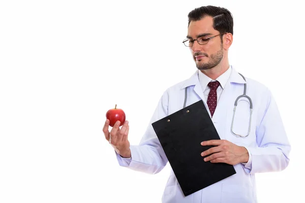 Studio colpo di giovane bello uomo medico tenendo appunti e l — Foto Stock