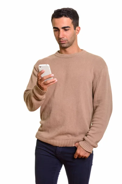 Young handsome Caucasian man using mobile phone — Stock Photo, Image