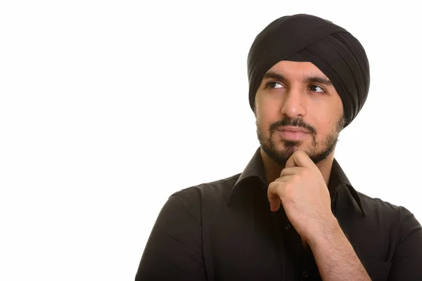 Jovem bonito indiano Sikh pensamento — Fotografia de Stock