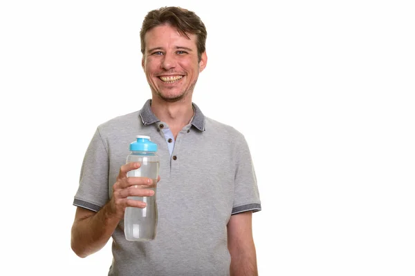 Happy Caucasian man holding water bottle — Stock Photo, Image