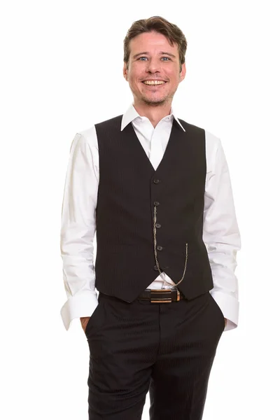 Onnellinen virallinen valkoihoinen mies hymyilee yllään liivi — kuvapankkivalokuva