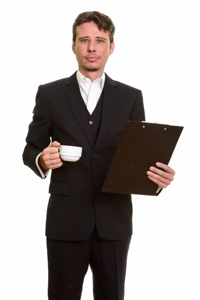 Schöner kaukasischer Geschäftsmann mit Klemmbrett und Kaffeetasse — Stockfoto