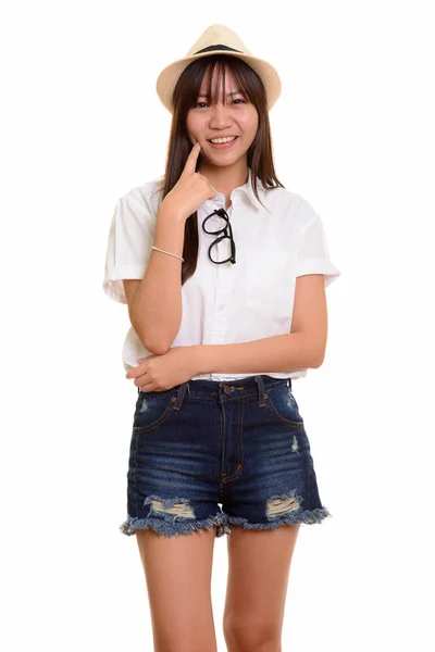 Junge glückliche asiatische Teenager-Mädchen lächeln und denken bereit für va — Stockfoto