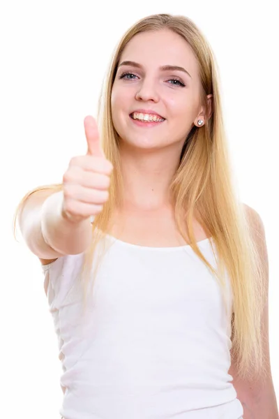 Estúdio tiro de jovem adolescente feliz sorrindo enquanto dá thu — Fotografia de Stock