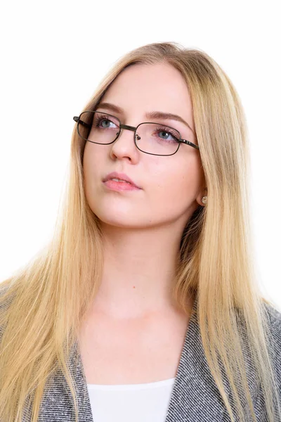 Face of young beautiful businesswoman thinking while looking up — Stock Photo, Image