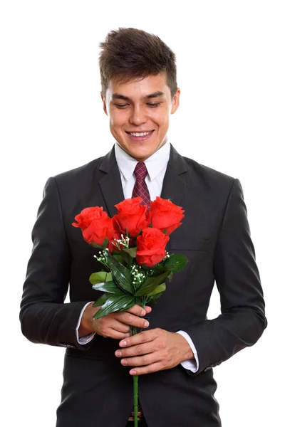 Ung glad affärsman leende medan du håller och tittar på röd — Stockfoto