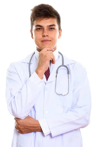 Studio shot of young handsome man doctor thinking — Stock Photo, Image