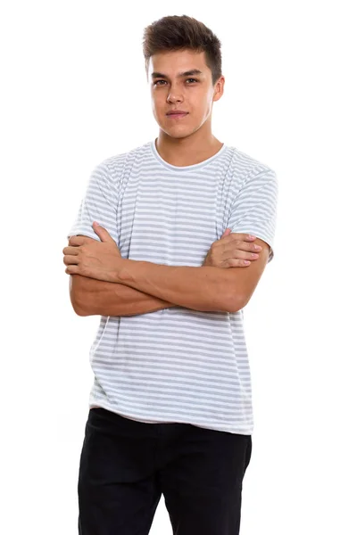Studio shot of young handsome man standing with arms crossed — Stock Photo, Image